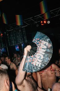 A group of people dancing in a club