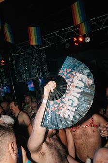 A group of people dancing in a club