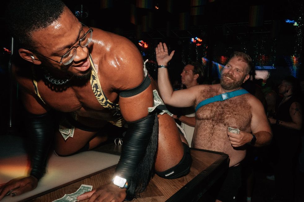 A go-go dancer getting his butt smacked by a tipper