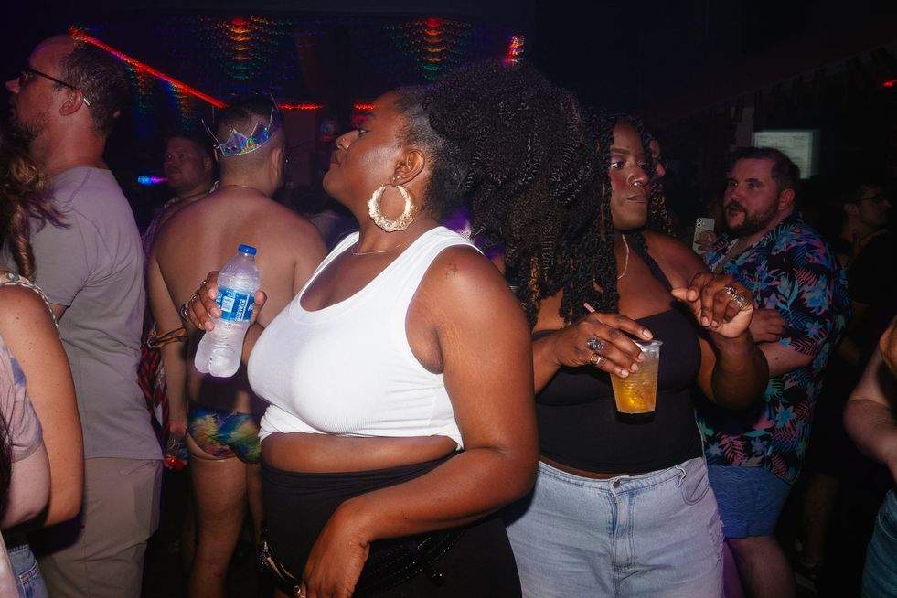 Queer women dancing in a club