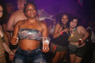 Queer women dancing in a club