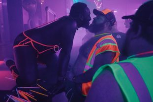 A go-go dancer dancing for a tipper