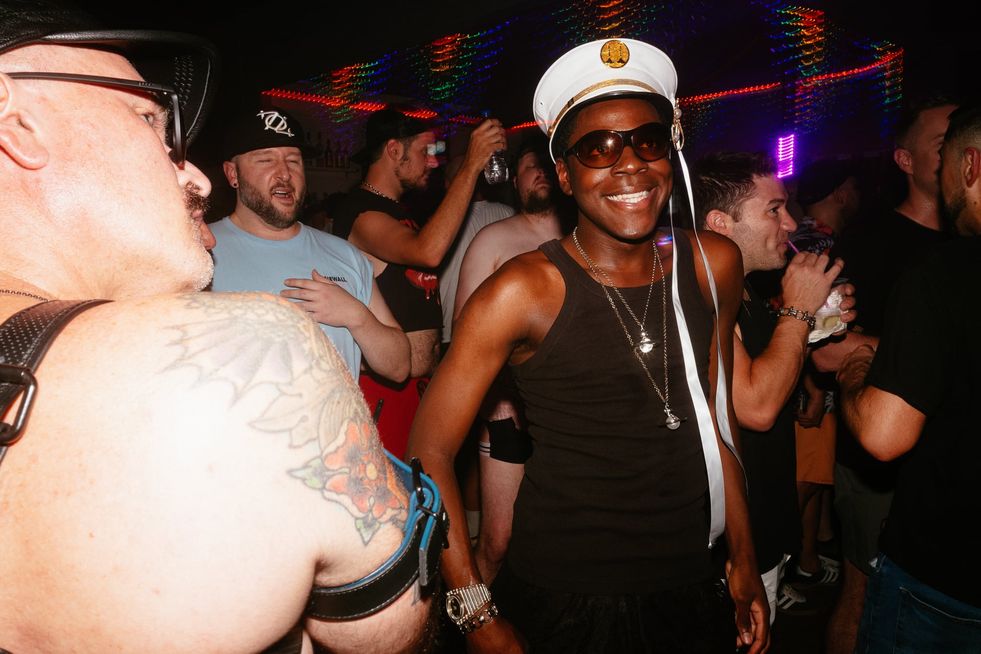 A group of queer men on the dance floor